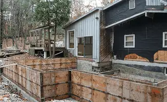 Prepared site with foundation forms for home remodeling and addition project in Hialeah, FL